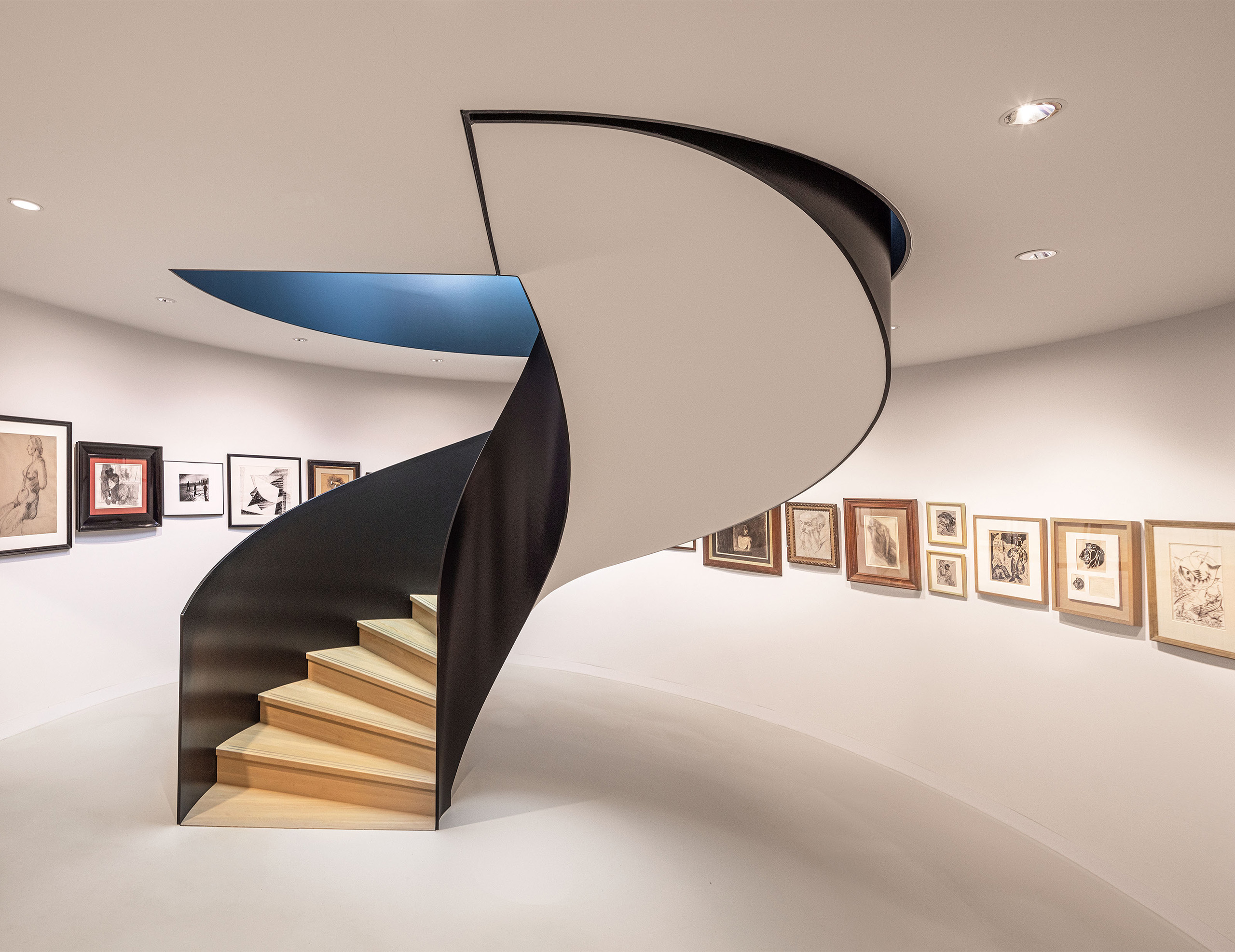 Sculptural stairs with art collection